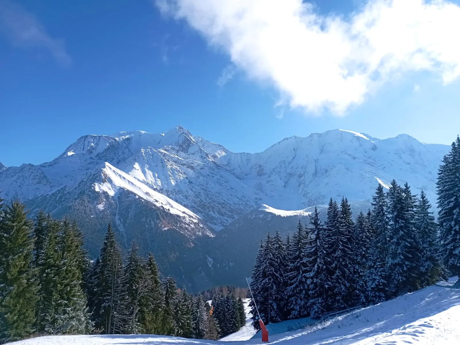 Snow-covered piste facing the Dômes de Miage and Mont Blanc